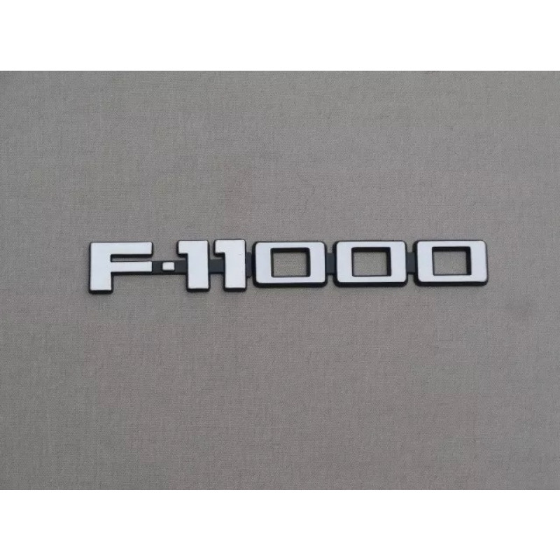 Emblema F-11000 Plástico - Par